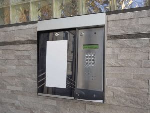 Intercom access to apartment building at entrance to lobby